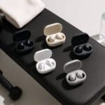 Best Wireless Earbuds for Gym 2025 on workout bench with dumbbells and water bottle